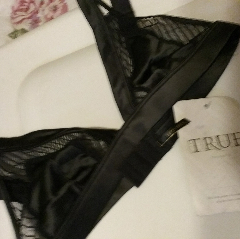 Black satin and lace bra